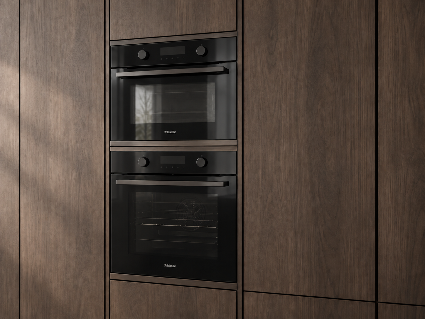 Black glass ovens with Miele branding integrated into smoked-walnut joinery