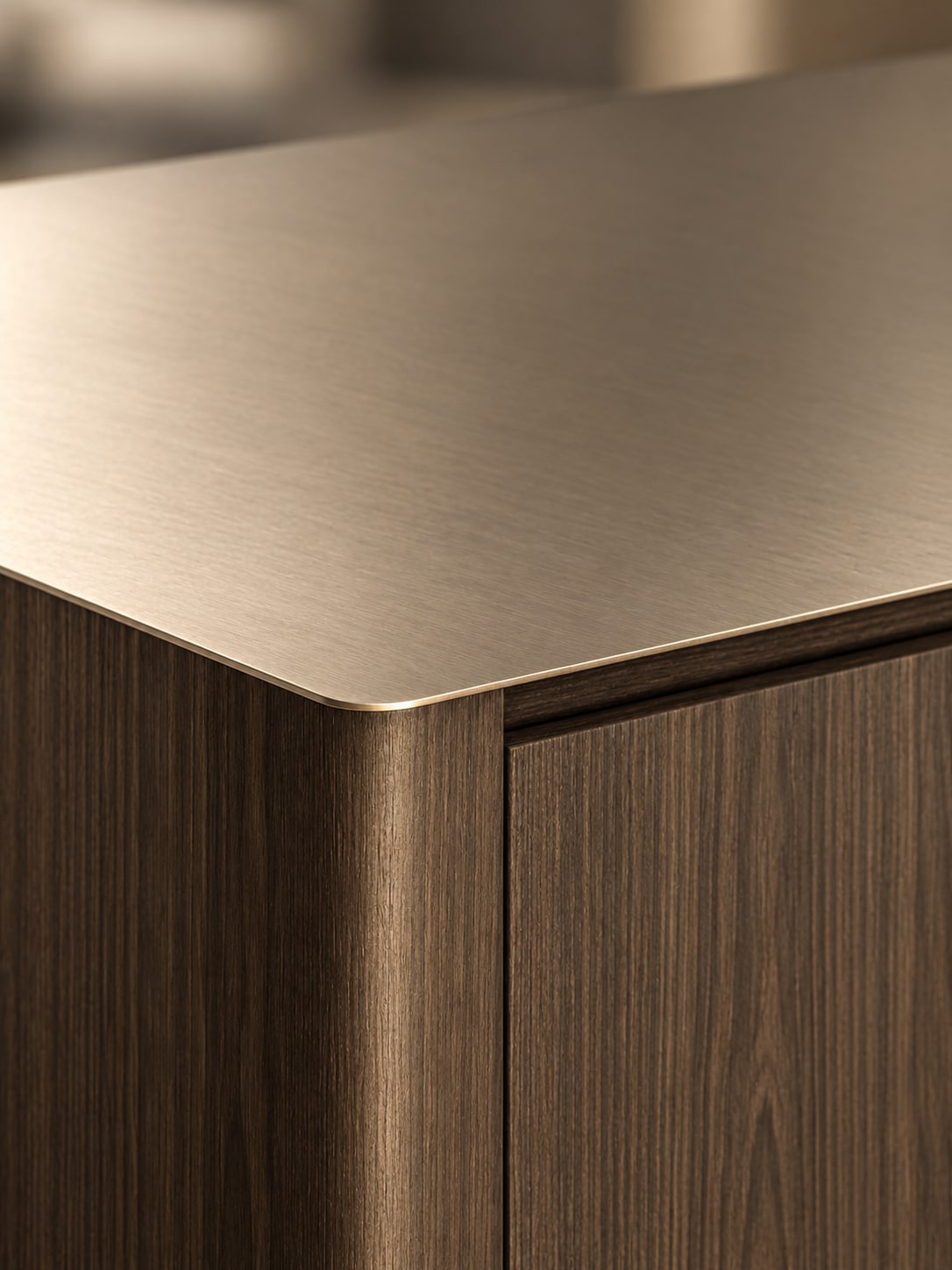 Brushed stainless-steel top meeting dark timber joinery at a refined rounded corner